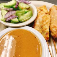 Chicken Satay (4) · Grilled marinated chicken in curry powder and coconut milk, served with peanut sauce and cuc...