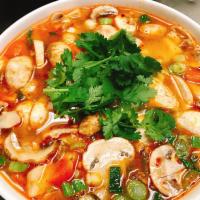 Tom Yum Soup Pot 32oz. · Thai lemony lemongrass soup with mushroom, tomato, scallion & cilantro.