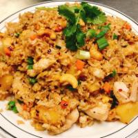 Pineapple Fried Rice · Jasmine rice wok with egg, onion, pineapple, cashew nut, curry powder, scallions.