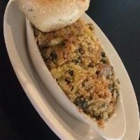 STINGER'S GREENS · A Hearty Spin Off the Classic Utica Greens with Italian Sausage Crumbles Topped with a Warm ...