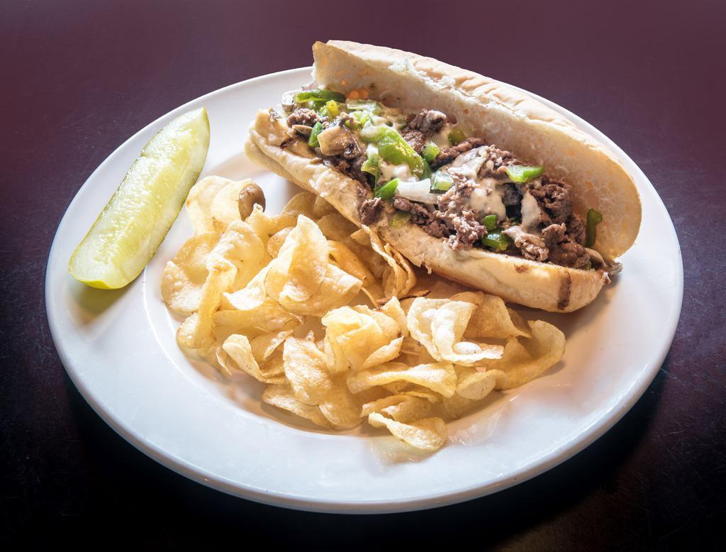 PHILLY STEAK · Our Hands Down, Best Selling, #1 Sub is the Philly Steak!  We Use Only the Finest Philly Steak Grilled with All the Classics - Savory Mushrooms, Sauteed Peppers & Onions with Melted American Cheese.  Served w/Kettle Chips