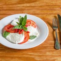 Mozzarella Caprese · Homemade mozzarella with roasted peppers and tomatoes.