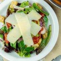 Mixed Greens Salad · Baby greens, parmesan, croutons, cucumber, carrots, grape tomatoes, red onion and your choic...