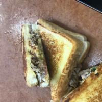 Philly Grilled Cheese · Philly steak with mozzarella cheese, peppers, onions and BBQ sauce. Stuffed inside a Texas t...