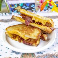 Grilled Bacon and Cheese on Sourdough · Applewood smoked bacon American cheese melted in sourdough.