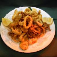 Fried Calamari · Served with marinara sauce and lemon wedges.