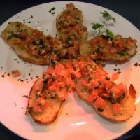 Bruschetta Siciliana · Grilled bread topped with tomato, garlic, cheese and basil.