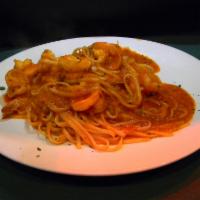 Shrimp Fradiavolo · Sauteed in a spicy tomato sauce and served over linguini. .
