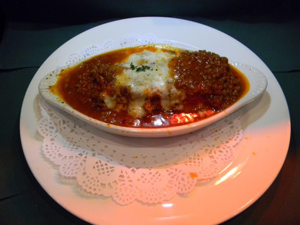 Lasagna Siciliana · Served with meat sauce. 