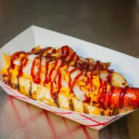 Music City Dog · Daddy Dog topped with bacon, cheddar cheese, onion and BBQ sauce.