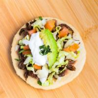 Sopes · Your choice of meat, beans, onion, cilantro, lettuce, tomato, sour cream, and avocado, showe...