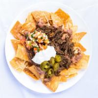 La Villa Nachos · Chips, your choice of Monterrey Jack cheese or yellow nacho cheese, beans, pico de gallo, so...