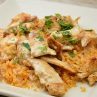 Grilled Chicken with Rice Dinner · Sliced of grilled chicken bread over a bed of rice, topped with nacho cheese and sprinkled w...