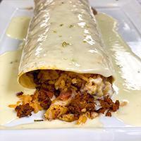 Burrito Tapatio · Burrito stuffed with grilled chicken, chorizo (Mexican sausage), beans, rice, pico de gallo ...