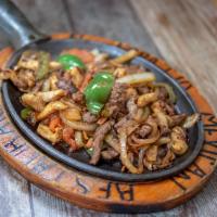 Mixed Fajitas Dinner · Tender slice a combination of chicken and beef. Cooked with onions, tomatoes and bell pepper...