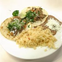 Tacos Milagrosos · A taco served with yellow corn 