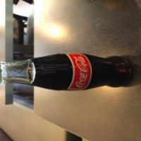 Mexican Coca Cola · Coca-Cola in a glass bottle, uses cane sugar