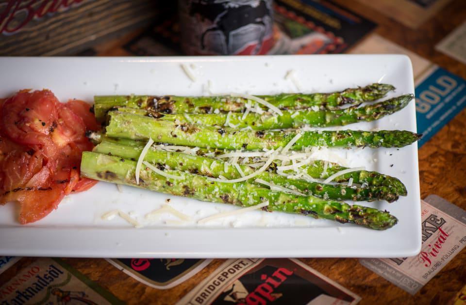 Grilled Asparagus Spears · Garlic oil, Reggiano and grilled Roma tomatoes.