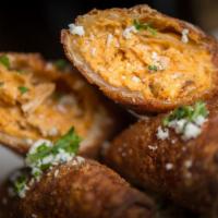 Buffalo Chicken Eggrolls · Shredded buffalo chicken, bleu cheese crumbles and chipotle ranch. Spicy.