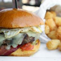 Hangover Burger · Jack, bacon, caramelized onions, grilled tomatoes and egg. These items may contain raw or un...