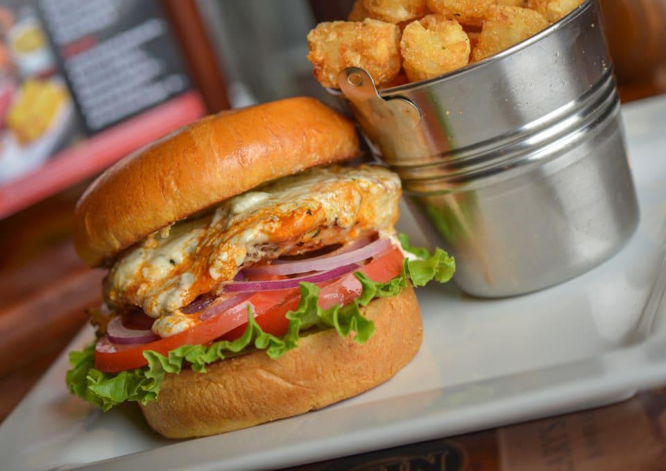 Buffalo Chicken Sandwich · Grilled chicken, buffalo sauce, bleu cheese crumble, lettuce, tomatoes and red onions. Spicy.