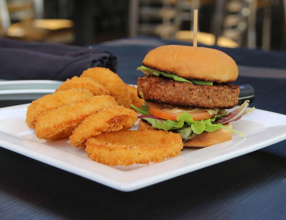 The Beyond Burger · 6 oz. vegan patty, baby greens, caramelized onions, tomatoes, avocado, garlic oil, served on a vegan bun. Add a second patty for an additional charge.