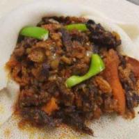 Quanta Firfir  · Ethiopian Jerk beef blended with injera onion garlic. Authentic mild spices with red sauce. ...