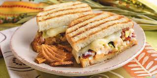 Chicken Pesto Panini · Grilled chicken breast, pesto mayo sauce, tomato, roasted peppers, red onions and mozzarella...