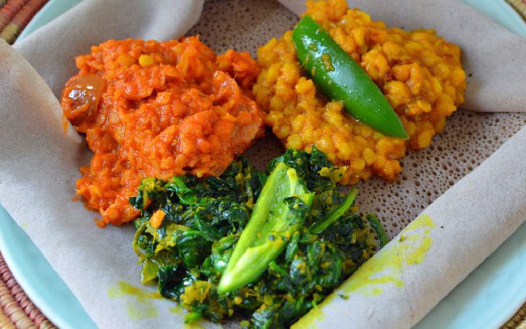 BEYAINETU ETHIOPIAN VEGAN AND VEGETARIAN PLATE · SPINACH
CABBAGE
RED LENTIL 
CURRY LENTIL
COMES WITH INJERA
