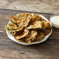 Zucchini Fritti · Freshly sliced, lightly coated and fried crisp, ranch dip.