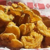 Fried Pickles · Beer- battered crispy pickle chips served with ranch dressing