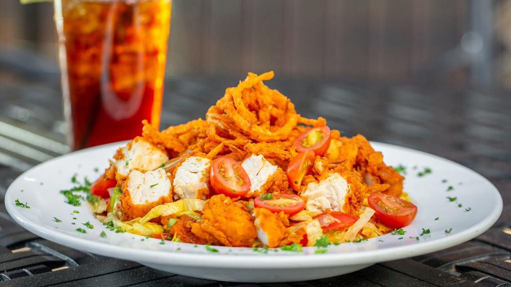 Buffalo Chicken Chopped Salad · Buffalo fried chicken, lettuce mix, smoked bacon, tomatoes, cucumber, & cheddar jack cheese, tossed in Ranch. Topped with crispy onion straws