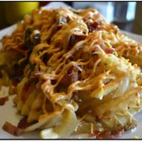 Phoenix Fries · Waffles fries, toss in jalapenos, grilled onions melt with cheese, bacon and
served with our...