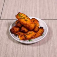 Fried Plantains · An island favorite. Ripened plantains, sliced and fried golden to capture that crispy and sw...
