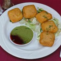 Vegetarian Delight  · A selection of vegetable samosa, vegetable pakora, aloo pakora, paneer pakora and vegetable ...