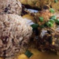 Curry Pork & Jerk Chicken · Served with rice and sweet plantains