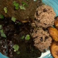 Oxtail & Jerk Chicken · Served with rice and sweet plantains