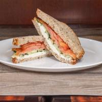 E. Irish Smoked Salmon Sandwich · Paper thin cucumbers and tomatoes with cream cheese on multi-grain bread. 