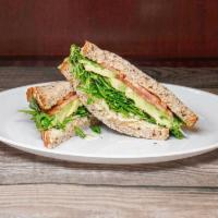 I. Hummus and Avocado Sandwich · With toasted pine nuts, arugula, chipped Parmesan and tomato on 7-grain bread. 