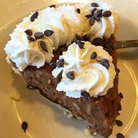 German Chocolate Slice · Chocolate cream, coconut and chopped pecans over a layer of chocolate. Topped with fresh whi...