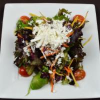 Ensalada De La Casa · Organic Mixed Greens | Carrots | Celery | Cherry Tomato | Corn | Ricotta Salata | Balsamic V...