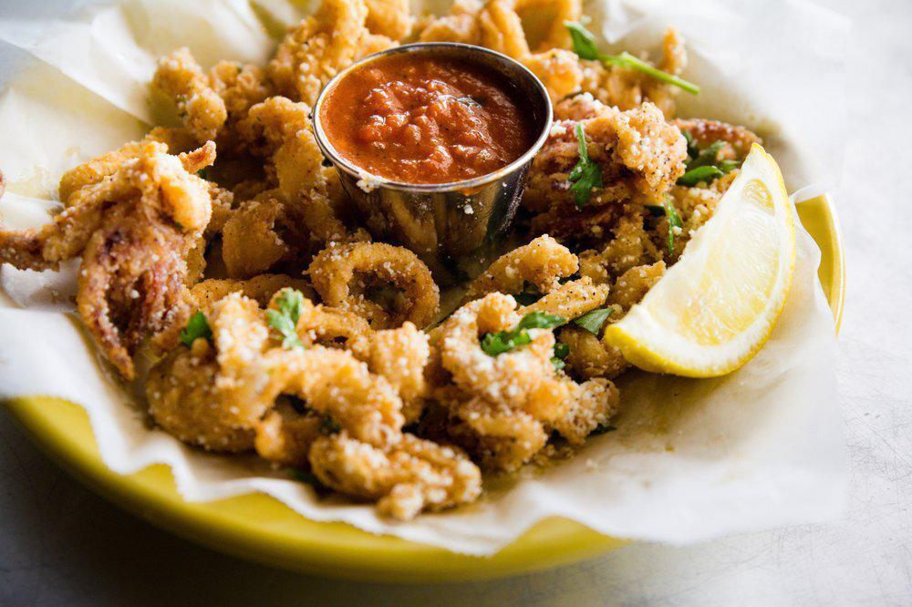 Calamari · Seasoned fried calamari. Served with spicy marinara.