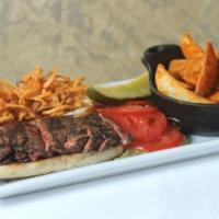 Prime Rib Sandwich · Coulotte steak topped with monterey jack cheese and crispy onion rings an garlic buttered ci...
