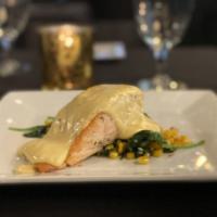 Seared Salmon Filet · With sauteed green beans, amonds, and garlice, served with vinegar and basil hollandaise.