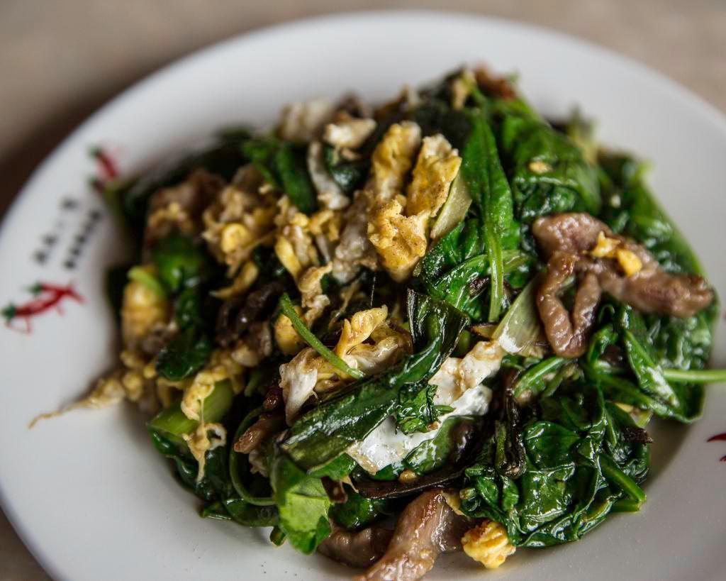 Henry's Shredded Pork · Sautéed with wood ear mushrooms, scallions, spinach, and eggs in a special sauce.
