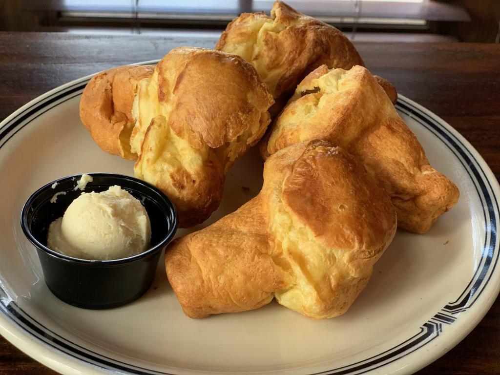 Mini Popovers · 4 homemade mini popovers with honey butter.