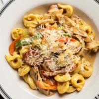 Big Easy Pasta · Tortellini, chicken, andouille sausage, peppers, onion, celery, creole cream, and Parmesan.