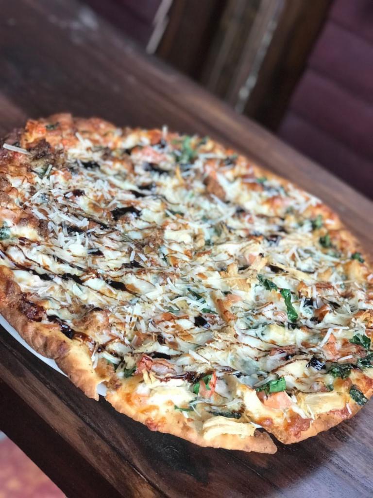 Chicken Bruschetta Pizza · Shredded chicken, tomato, red onion, basil, olive oil, and garlic. Topped with parmesan and balsamic glaze