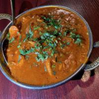 33. Karahi Chicken · Boneless chicken cooked with garlic, ginger, tomatoes, and spices.