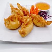 4. Crab Puffs · 5 pieces. Served with plum sauce.